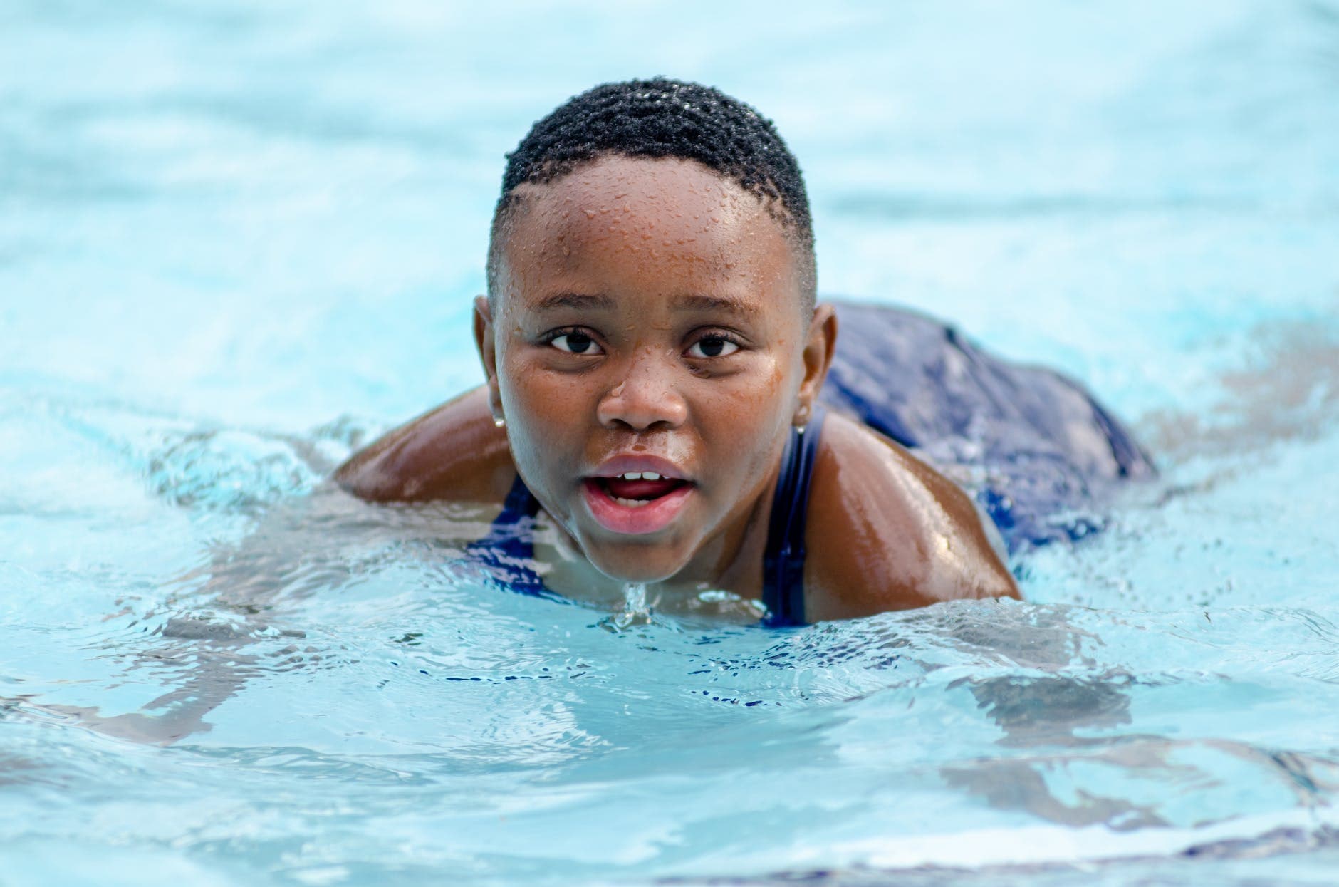 kid swimming in pool
