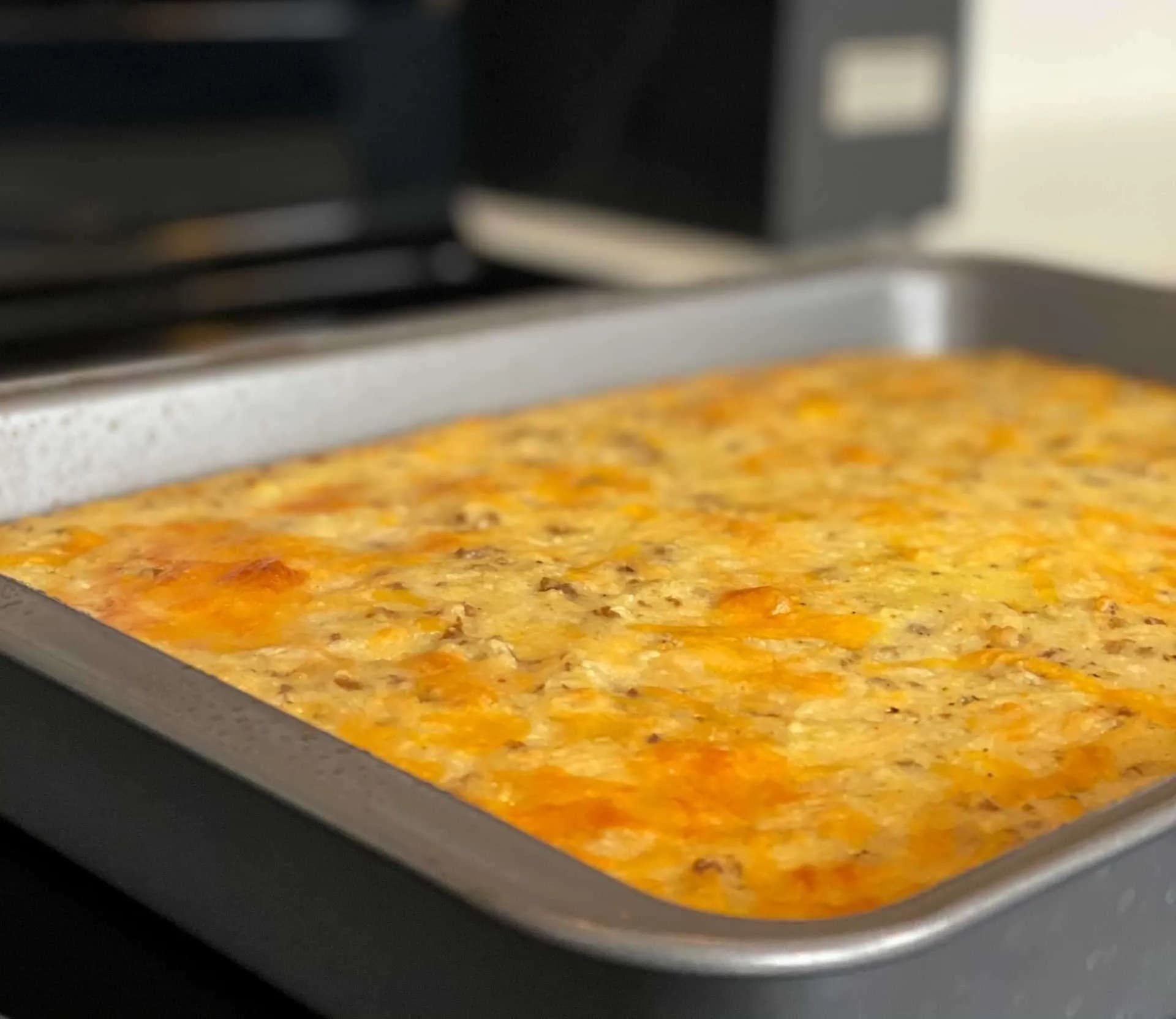 Uncut grits casserole sitting on a stove