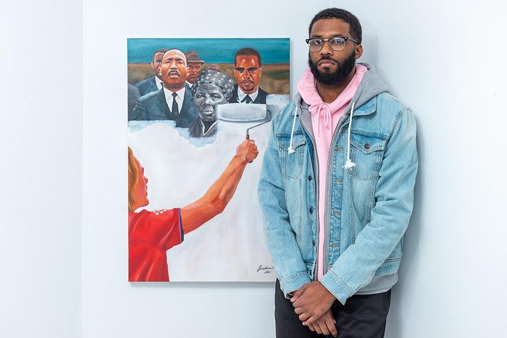 A person holding a painting
Description automatically generated with low confidence